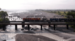 Train traveling over a bridge