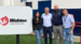 Priyanka with her co-workers by Wabtec sign