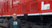 Man standing in front of Wabtec train 