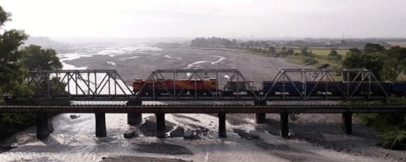 Train traveling over a bridge