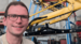 Hendrik in front of large equipment